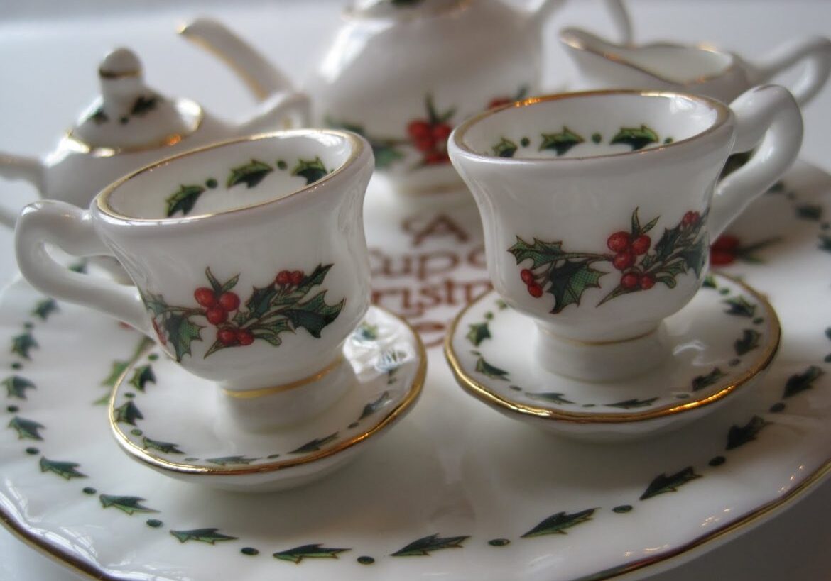 Elegant teacups with floral patterns on a matching saucer.