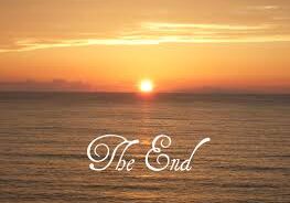 Golden sunset over sea with The End