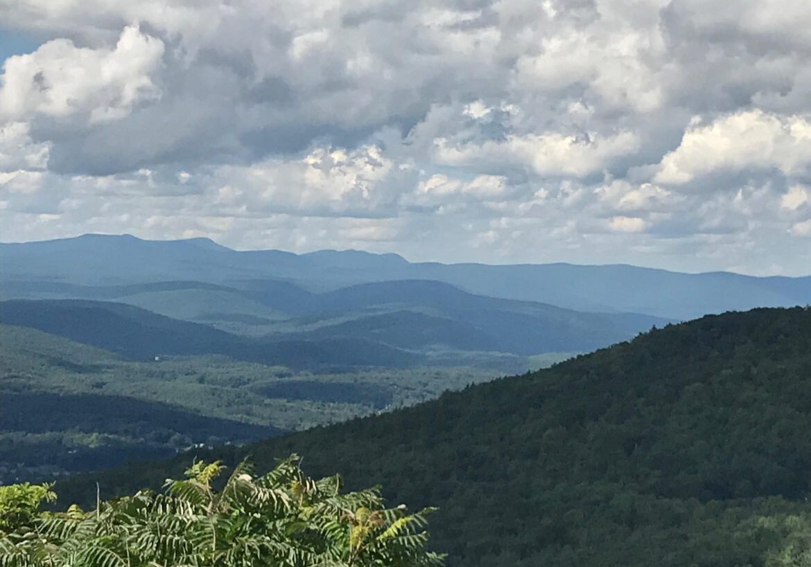 Scenic mountain landscape under a partly cloudy sky.