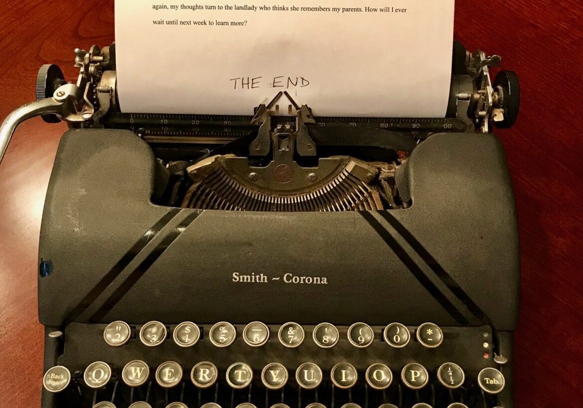 Vintage Smith‑Corona typewriter with "THE END